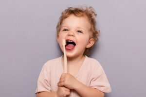 cute toddler with toothbrush